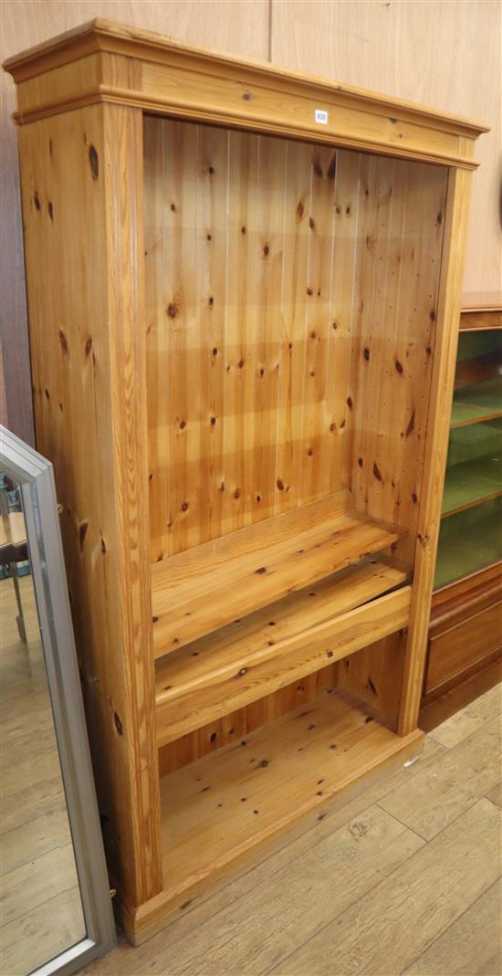 A reproduction pine open fronted bookcase W.103cm